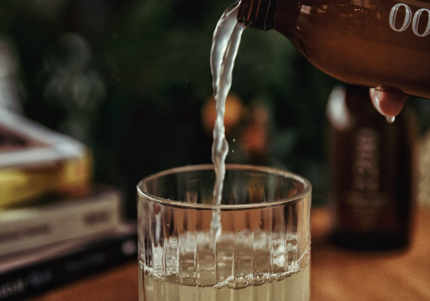 Kombucha being poured into a glass.